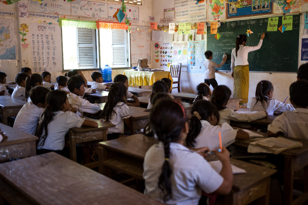 Schoolchildren in Koah Rokar village where schools receive 10 free 20-litre bottles of treated water per day.
